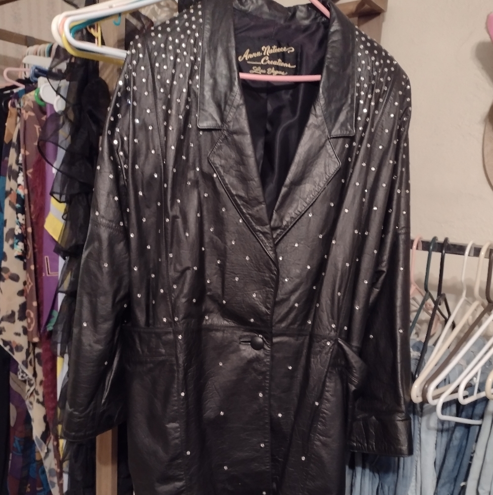 LEATHER JACKET WITH CRYSTAL RHINESTONES.